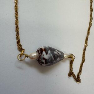 Handcrafted gold cone shell necklace with natural pearls
